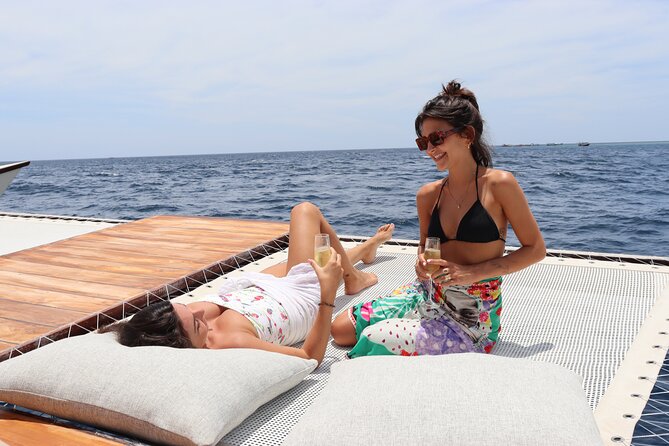 4-in-1 • Gili Islands Snorkel & Sunset Half-day Catamaran Cruise - Onboard fun: paddle boards, beanbags, roof jumps, and a real bar