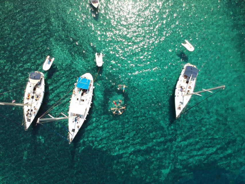 Adamantas: Milos Sightseeing Sailboat Cruise - Sykia Cave: The Dinghy Passage, Skylight Salt Lake, and Green Water Snorkel