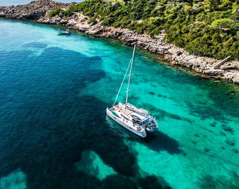 Alghero catamaran sunset tour Alghero - La Maddalenetta anchor stop: swim, snorkel, and SUP time