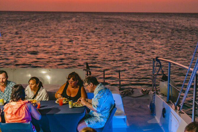 Aruba Sunset Sail Dinner Cruise with Open Bar by Catamaran - Watching the Sunset From the Water: coastline views and real-world weather changes