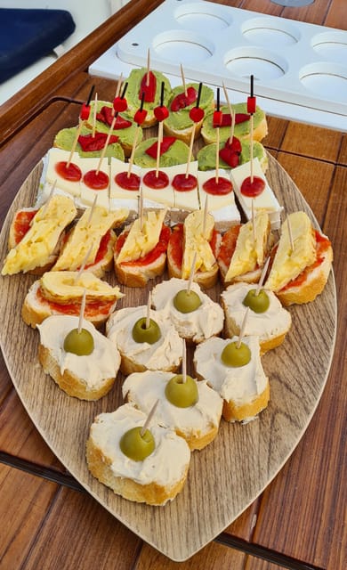 Barcelona: Sailing Tour with Spanish Tapas and Drinks - Tapas and drinks onboard: what $55 actually buys you