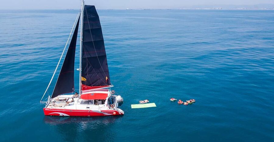 Barcelona: Sunset or Day Catamaran Cruise with Tapa & Drink - Finding Marina Vela and the This Is MED Meeting Point