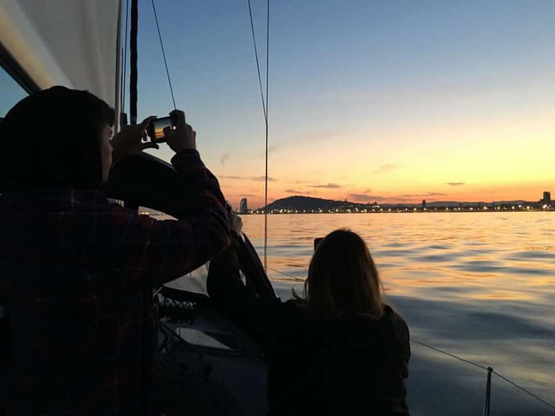 Barcelona: Sunset Sailboat Cruise with Open Bar and Snacks - Sunset views you’ll actually enjoy: city skyline from sea level