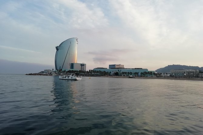 Barcelona Sunset Sailing Cruise from Port Olímpic with Open Bar - Maremagnum from pontoons: modern shopping, seen sideways