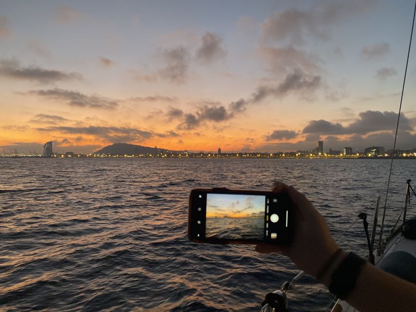 Barcelona: Sunset Sailing Tour with Open Bar & Snacks - The swim stop and the marine-life lottery