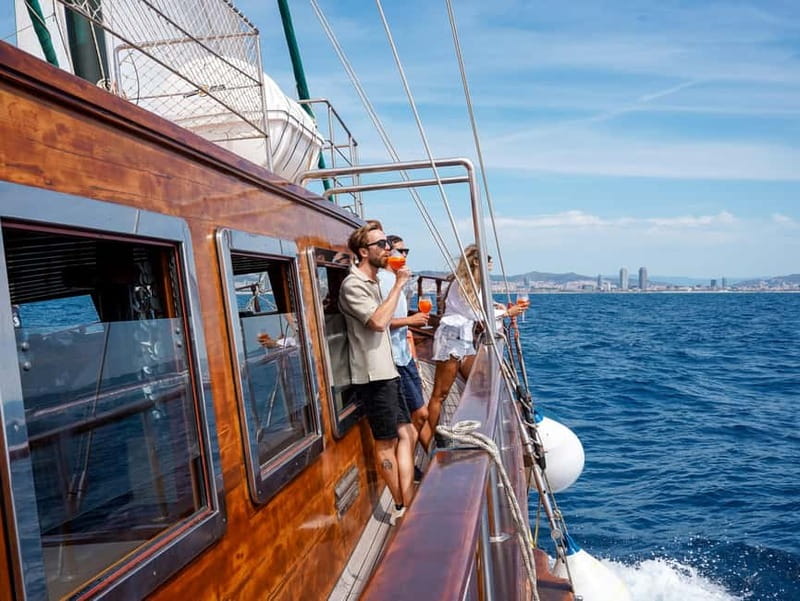 Barcelona: Wooden Boat Sailing with Tapa and Welcome Drink - Music, the Onboard Bar, and That VIP-Photo Energy