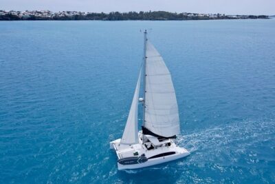 Bermuda Private Catamaran:Snorkeling, Shipwrecks & Cliff Jumping - Paddle boarding and swimming in clear turquoise water