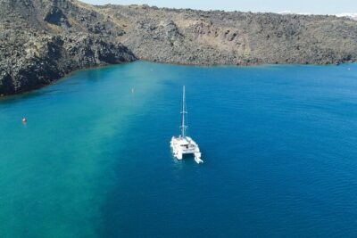 Best of Santorini Private Half-Day Catamaran Cruise with transfer and meal - Hotel pickup and the Vlichada meeting point