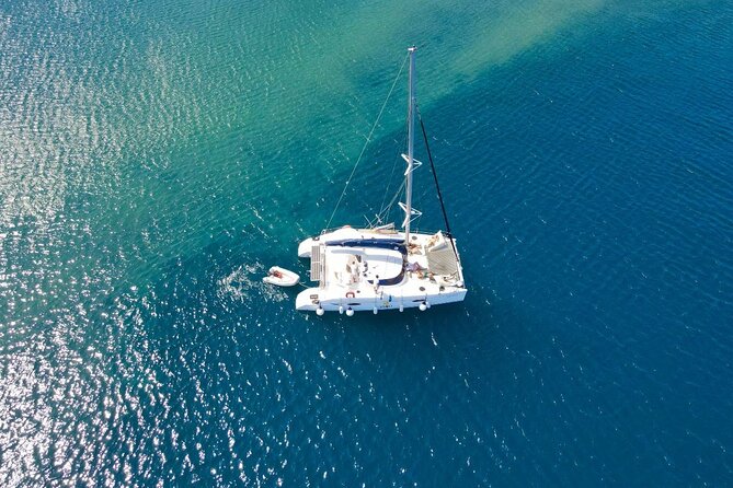 Best of Santorini Private Half-Day Catamaran Cruise with transfer and meal - White Beach by sea: less crowded, clearer water