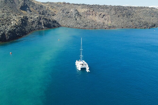 Best of Santorini Private Half-Day Catamaran Cruise with transfer and meal - Hotel pickup and the Vlichada meeting point