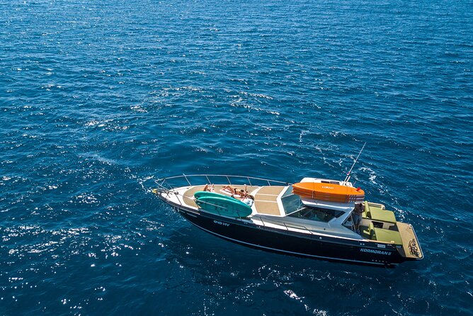 Blue & Green cave tour with yacht from town Hvar - Stop 1: Budikovac Island and the Blue Lagoon style swim