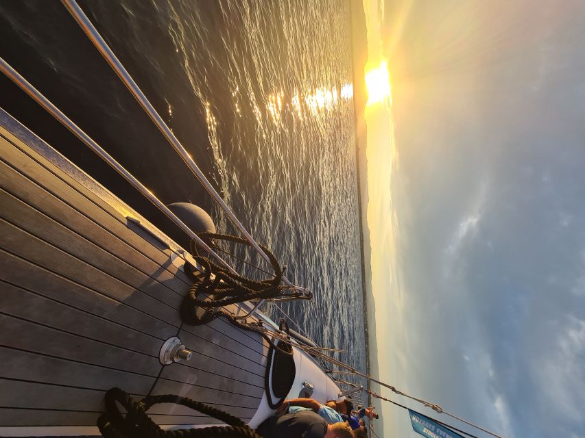 Cambrils: Costa Dorada Sunset Catamaran Cruise with Drinks - The Swim Break: Quiet Inlet Time and Snorkel Options