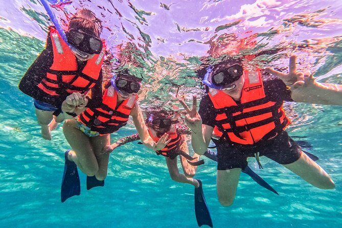 Cancun All Inclusive Catamaran Tour to Isla Mujeres - Isla Mujeres beach club lunch: Views, buffet food, and chair reality