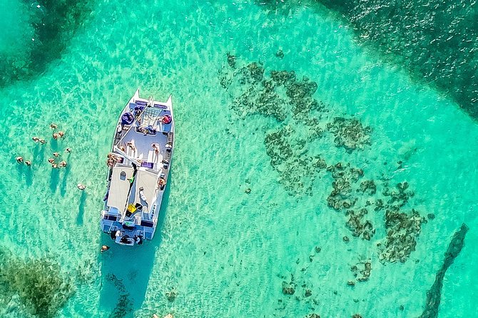 Catamaran Cruise with Snorkeling & Parasailing - Open bar, snacks, and music on the catamaran: what the party vibe adds