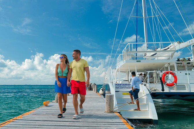 CATAMARAN to Isla Mujeres, Snorkel & Beach Club by Xcaret - Stop 2 Snorkeling at El Meco Reef: Shallow Water, Warm Temps, and MUSA Statues