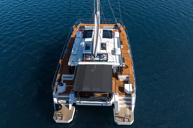 Comfort Max Catamaran Caldera Cruise with BBQ and Drinks - Volcano Stop: Unmanned Beaches and the Hot Springs Vibe