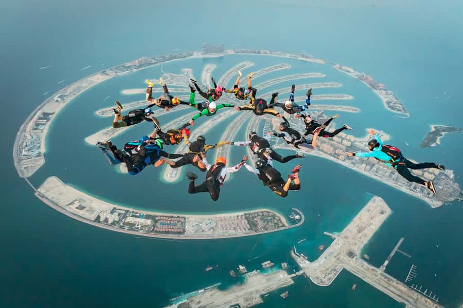 Dubai: Skydive at The Palm with Photos, Video & Yacht Tour - Parachute Opens Around 6,000 ft: 4–5 Minutes Under Canopy
