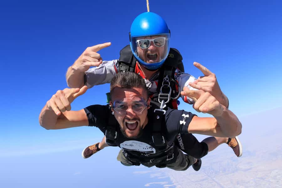 Dubai: Skydive at The Palm with Photos, Video & Yacht Tour - The Day’s Ground Time: Check-In, Watching From Below, and the Cafe