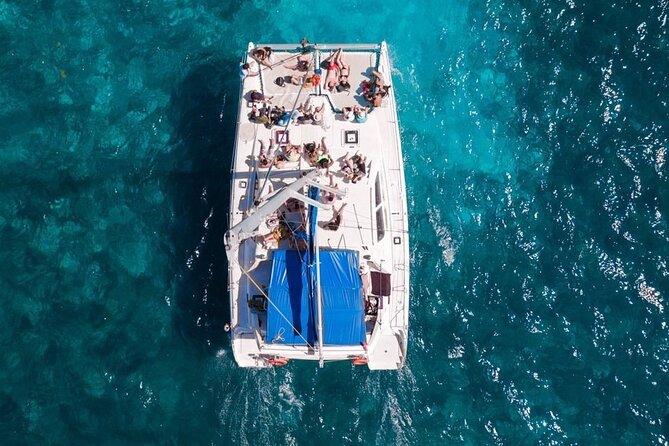 Exciting Catamaran Tour to Isla Mujeres, from Cancún! - Onboard Vibe: Open Bar, Music, and the Crew Energy