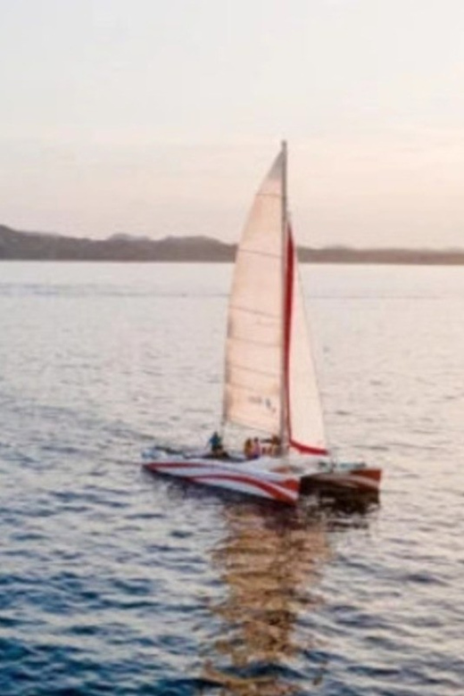 Fornells: Catamaran Sunset Cruise of Menorca's Coast - Swimming time: warm water, easy fun, and good photo breaks