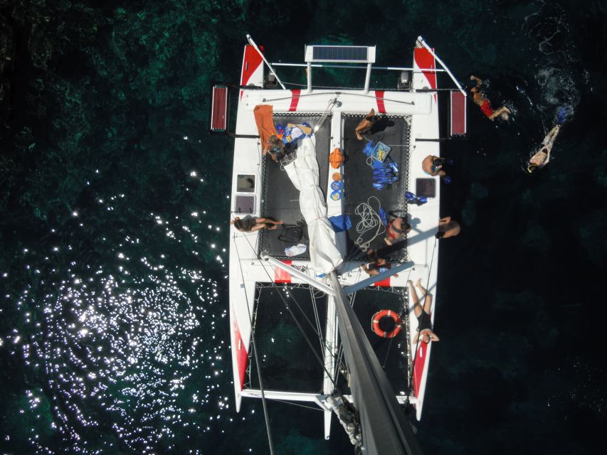 From Fornells: Half-Day Menorca Catamaran Trip w/ Snorkeling - Unlimited drinks and snacks: the value is in not having to think