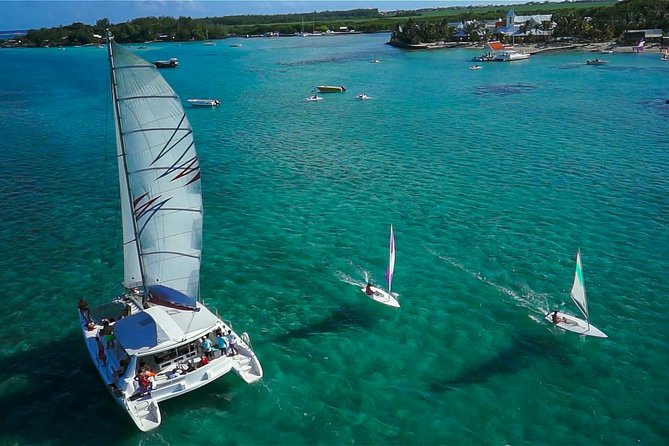Full-Day Catamaran Cruise to Île aux Cerfs with BBQ Lunch - Île aux Cerfs time: the sandbank drop, barefoot relaxation, and parasailing options