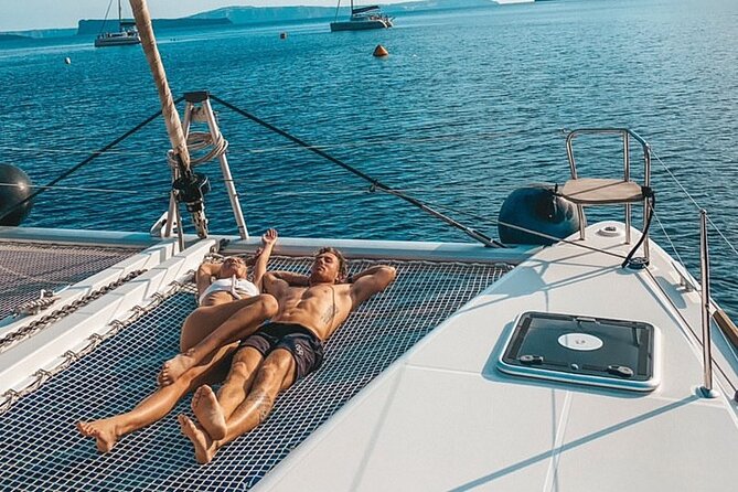 Half-Day Exclusive Catamaran Cruise in Santorini with Meal and Open Bar - Prosecco, Wine, Beer, and the On-Board Vibe