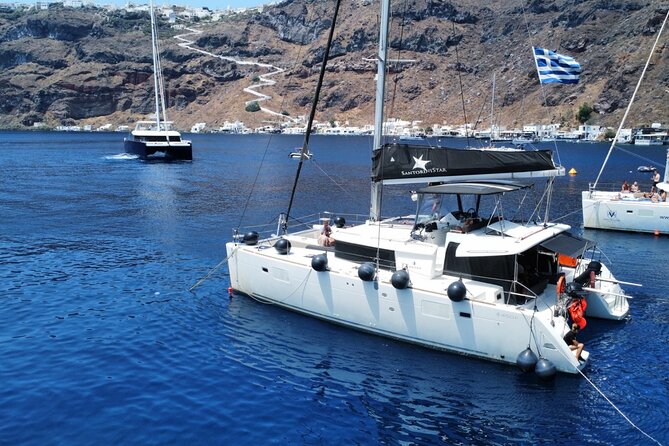 Half Day Premium Catamaran Cruise in Santorini including Oia - Premium catamaran basics: what you’re really buying in 5 hours