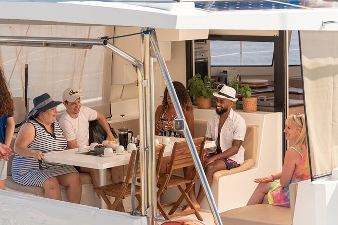 Hersonissos: Luxury Sunset Catamaran Cruise Sushi & Open Bar - The catamaran setup: shade, sunbeds, and space that feels grown-up
