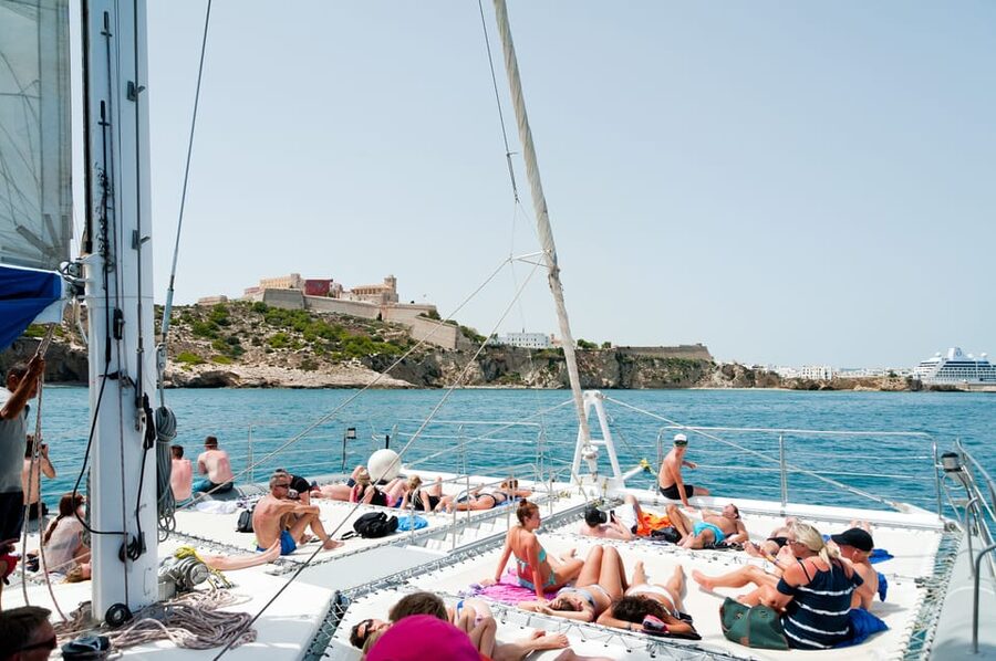 Ibiza: Catamaran Cruise to Formentera with Meal and Drinks - From Botafoch to the Sun Cat: start strong, then relax