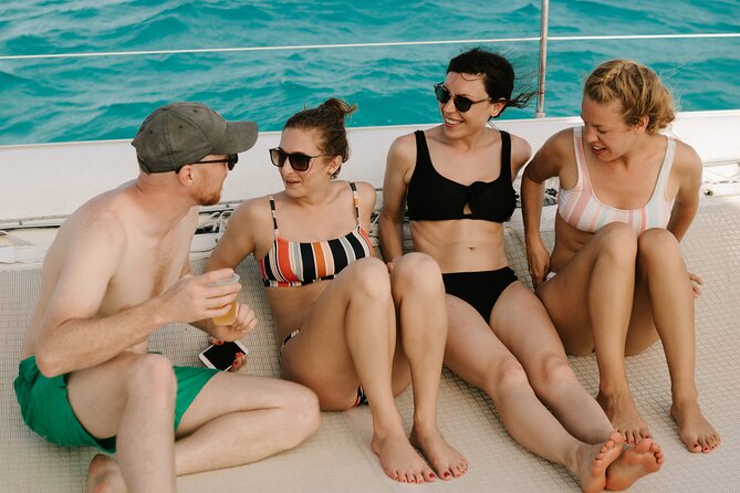 Isla Mujeres Catamaran Tour with Open Bar, Lunch and Snorkeling - The return trip: sunset views plus drinks keep the energy up