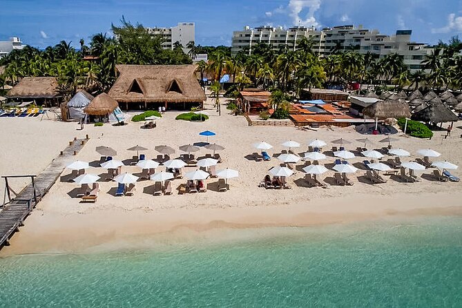 Isla Mujeres luxury catamaran with premium open bar and lunch - VIP beach club lunch at Zama or IXI (and how the timing feels)