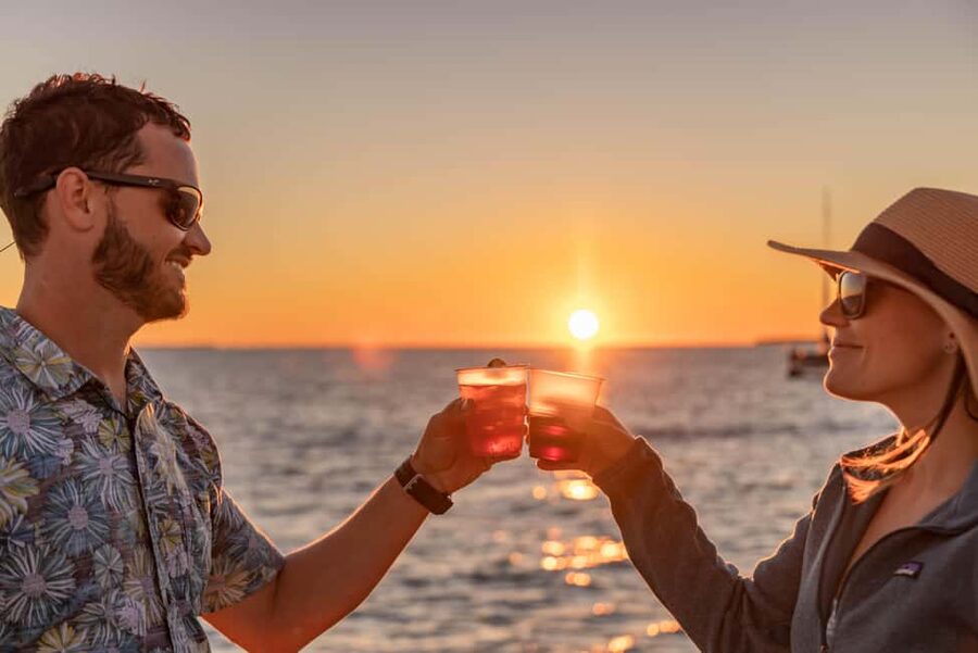 Key West: Sunset Sailing Trip with Open Bar, Food and Music - Dolphins, clouds, and the weather reality check