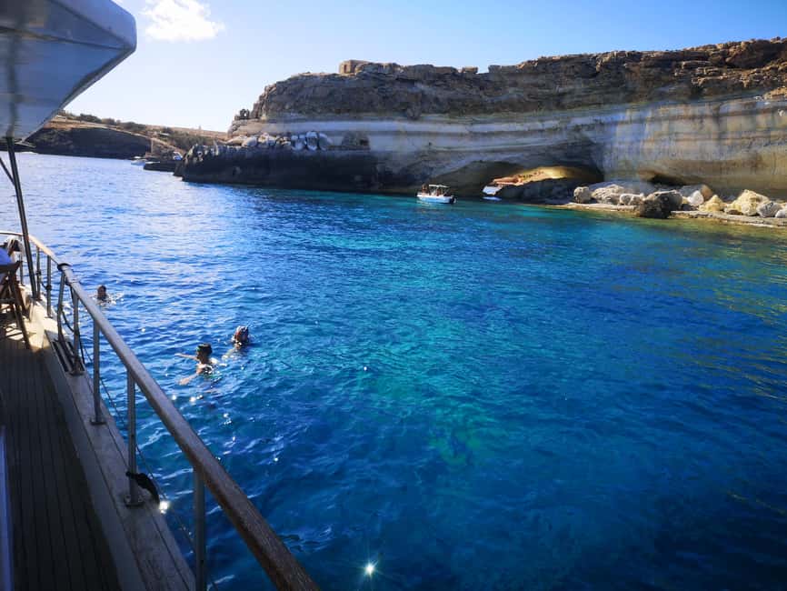 Lampedusa: Yacht excursion, swimming stops and typical lunch - Punta Muro Vecchio: Caves Close-Up and Sapphire Waters