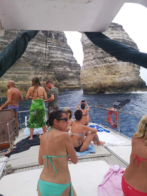 Lampedusa: Yacht excursion, swimming stops and typical lunch - The Lunch on Board: Fish Courses, House Caponata, and Wine