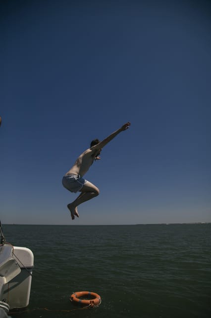 Lisbon: Catamaran Boat Party with Music, Open Bar & Dives - Price and Value: Is $57 for 3 Hours Fair?