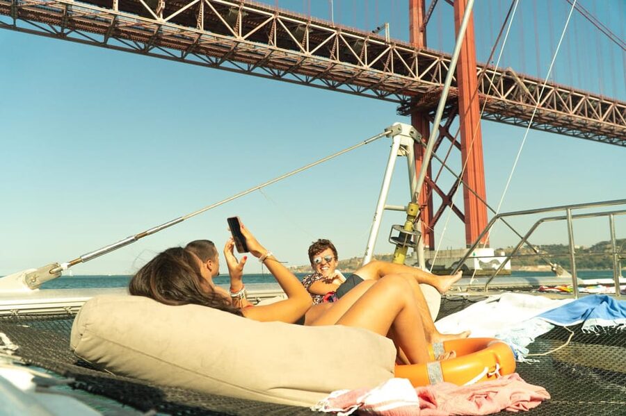Lisbon: Catamaran Boat Party with Music, Open Bar & Dives - Finding the Boat: Doca de Santo Amaro Door 3 in Alcântara