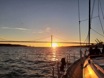 Lisbon: City Skyline Sailboat Cruise with Drink and Snacks - Santo Amaro Dock to Praça do Comércio: Starting Under the 25 de Abril Bridge
