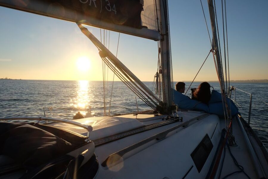 Lisbon: City Skyline Sailboat Cruise with Drink and Snacks - Drinks, Snacks, and the Crew’s Multilingual Style