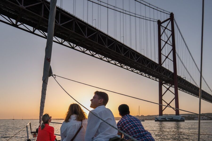 Lisbon: Daytime/Sunset/Night City Sailboat Tour with Drink - Under the 25 de Abril Bridge: The Signature Lisbon Moment