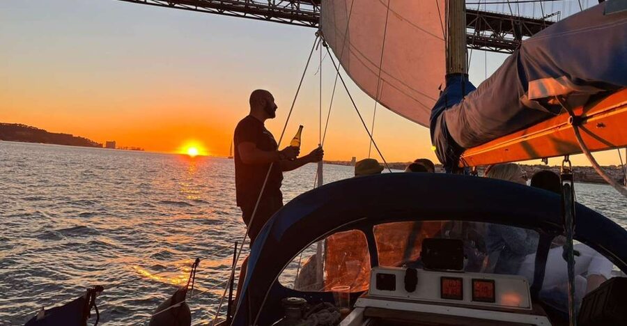 Lisbon: Sailboat Sunset Tour with a Drink - The onboard vibe: a real guide, a real captain, and a relaxed pace