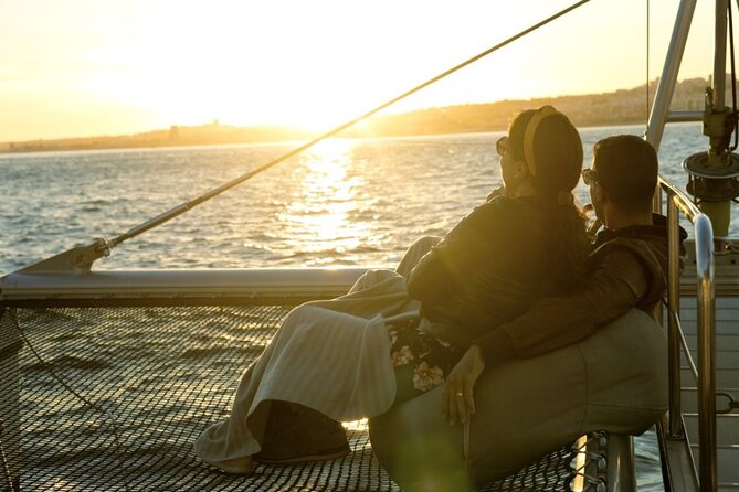 Lisbon: Sunset Catamaran Boat Tour with Music and Drinks - Nets, Blankets, and Music: How the 90 Minutes Feel