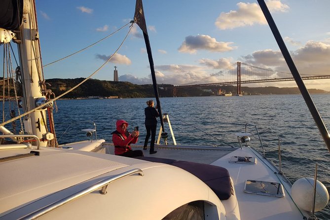 Lisbon: Sunset Cruise With Drinks on Spacious Yacht - Arriving at Mercedes-Benz Oceanic Lounge Under the 25 de Abril Bridge