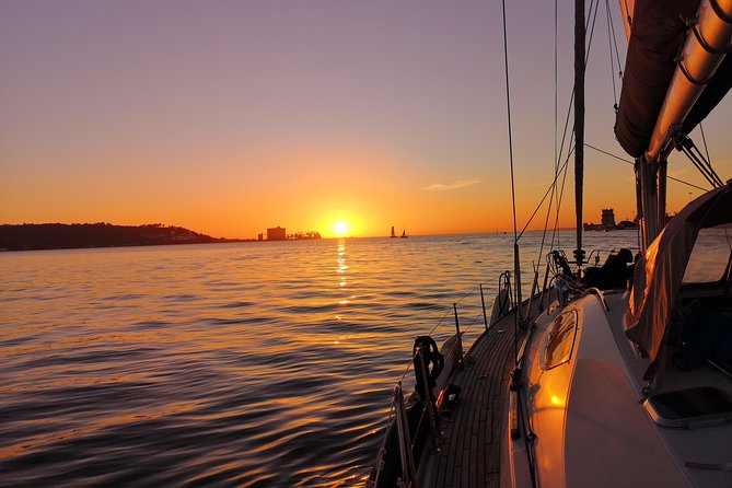 Lisbon Sunset Sailing Tour on Luxury Sailing Yacht with 2 Drinks - The mid-cruise drink and Portuguese bites (2 drinks included)