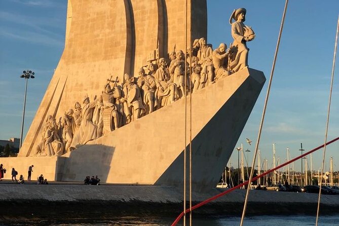 Lisbon Sunset Sailing with Portuguese Wine and History - Sailing the Tagus: 25 de Abril Bridge to Almada in golden light