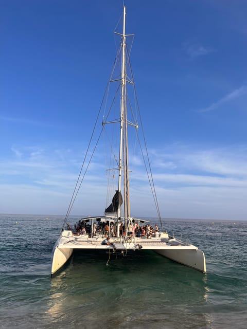 Lloret de Mar: Sunset Catamaran Cruise with DJ and Drinks - Key highlights you’ll care about