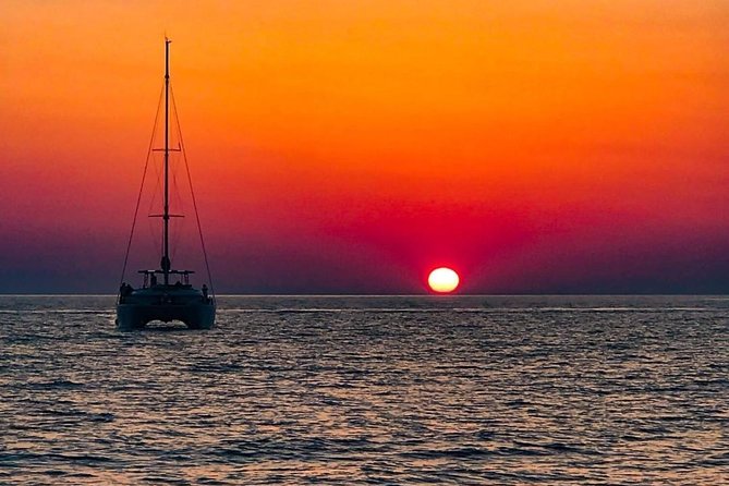 Luxury Small-Group Catamaran Cruise with BBQ, Open bar & Transfer - Getting to the Boat: Ammoudi or Vlychada, Plus a Smooth Mini-Bus Ride