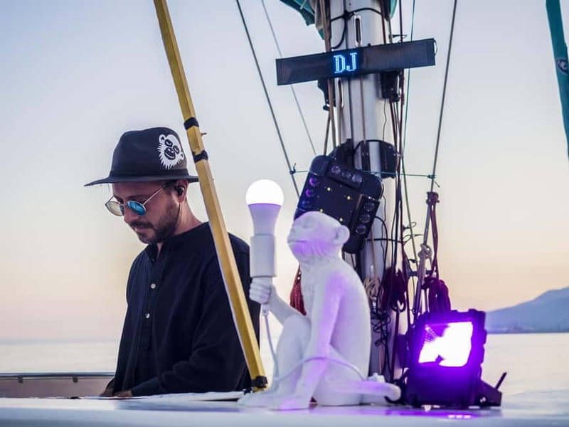 Malaga: Sailing Catamaran Sunset Cruise with Live DJ & Drink - Where you board the catamaran in Málaga (and what to expect before departure)