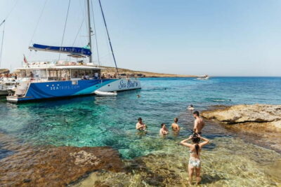 Malta: Blue Lagoon, Beaches & Bays Trip by Catamaran - The Blue Lagoon swim: turquoise water, less crowd stress