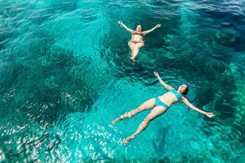 Malta: Blue Lagoon, Beaches & Bays Trip by Catamaran - On-board vibe: music, cocktails, and space to actually sit